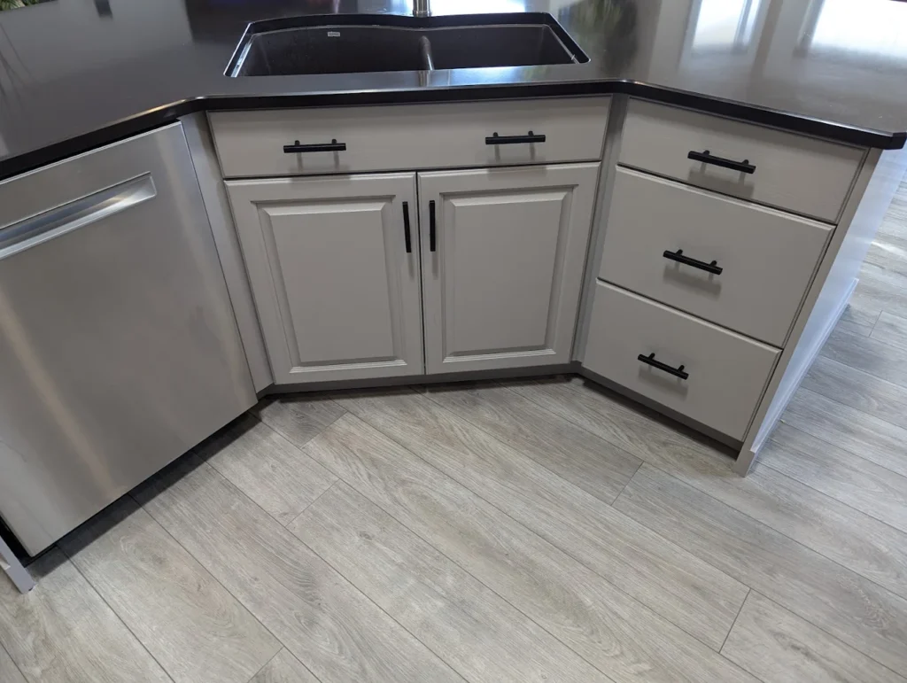 a kitchen that had its counters and cabinets painted gray by fhg contracting in beaumont alberta canada