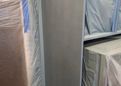 a bathroom with cabinets being finished and painted by FHG Contracting