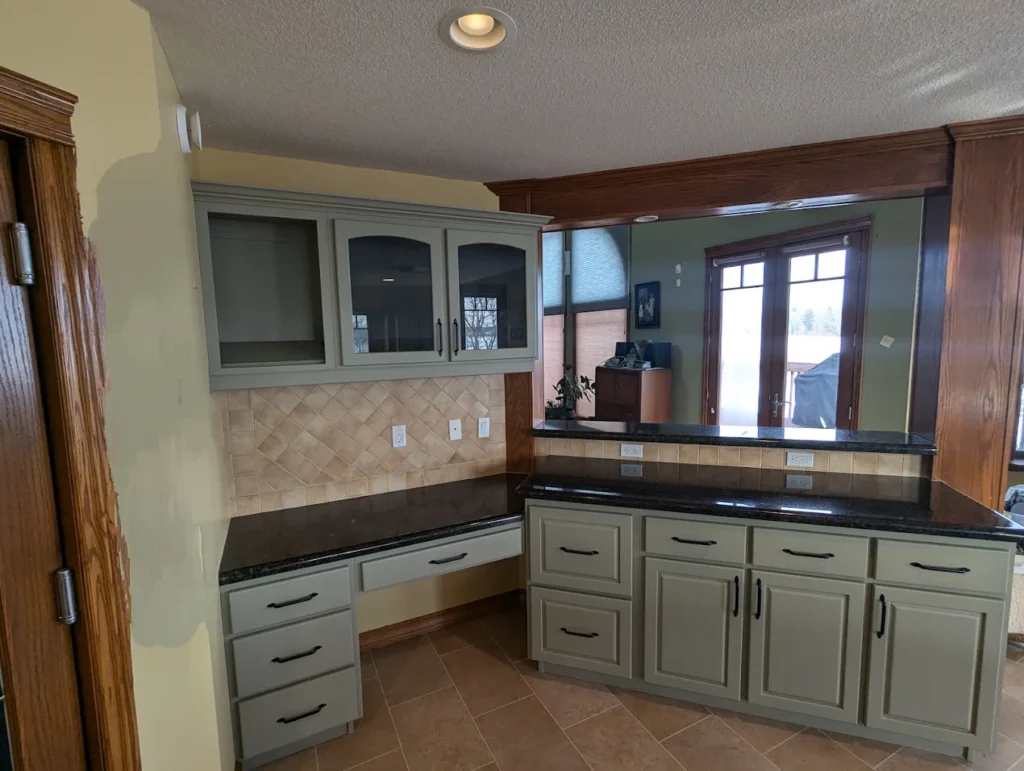a kitchen that had its counters and cabinets painted gray by fhg contracting in beaumont alberta canada