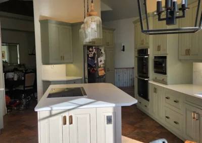 Kitchen cabinets that were refinished and painted in an Alberta kitchen by FHG Contracting