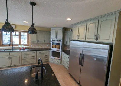 Kitchen cabinets that were refinished and painted in an Alberta kitchen by FHG Contracting