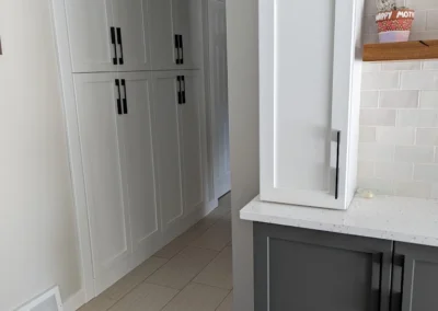 Kitchen cabinets that were refinished and painted in an Alberta kitchen by FHG Contracting
