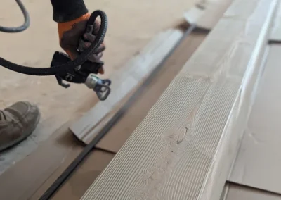 Wood being finished before being applied to a staircase