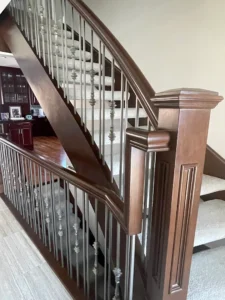 Staircase in Canada with wood refinished and stained by FHG Contracting