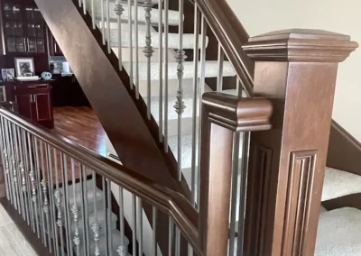 Staircase in Canada with wood refinished and stained by FHG Contracting