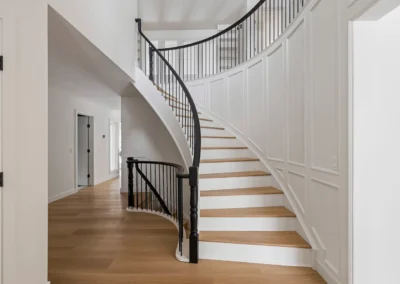 Staircase in Canada with wood refinished and stained by FHG Contracting