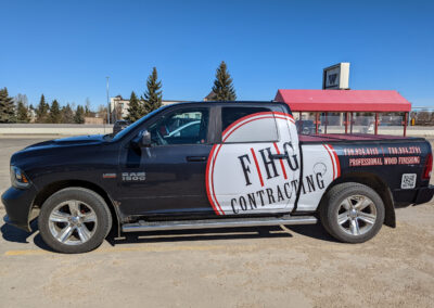 a pickup truck with the FHG Contracting logo on the side of it