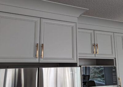kitchen cabinets that were painted white by FHG Contracting
