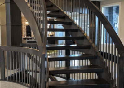 Staircase in Canada with wood refinished and stained by FHG Contracting