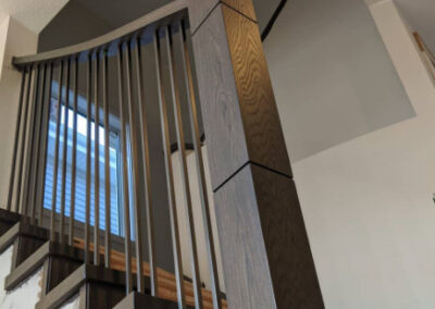 Staircase in Canada with wood refinished and stained by FHG Contracting